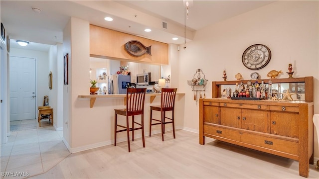 1133 Van Loon Commons Cir Unit 202, Cape Coral, FL 33909 - bar with stainless steel appliances and recessed lighting