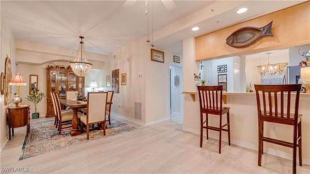 1133 Van Loon Commons Cir Unit 202, Cape Coral, FL 33909 - dining area featuring a chandelier, wood finished floors, and recessed lighting