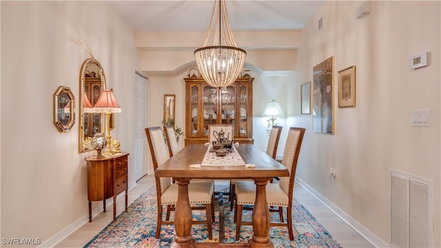 1133 Van Loon Commons Cir Unit 202, Cape Coral, FL 33909 - dining room featuring a chandelier and light wood finished floors