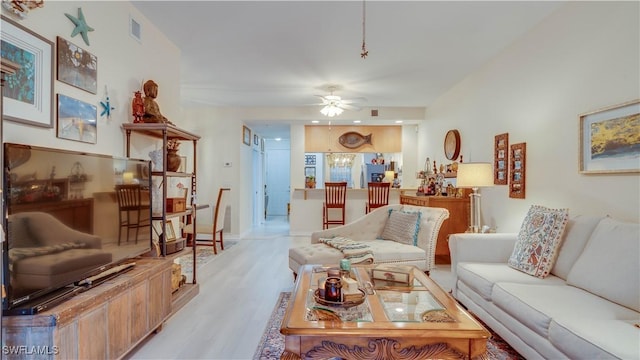 1133 Van Loon Commons Cir Unit 202, Cape Coral, FL 33909 - living room featuring a ceiling fan and light wood-style flooring