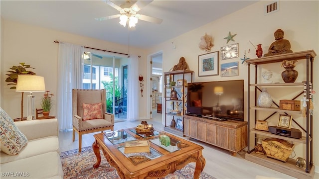 1133 Van Loon Commons Cir Unit 202, Cape Coral, FL 33909 - living room with a ceiling fan and wood finished floors