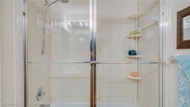 1133 Van Loon Commons Cir Unit 202, Cape Coral, FL 33909 - bathroom featuring bath / shower combo with glass door