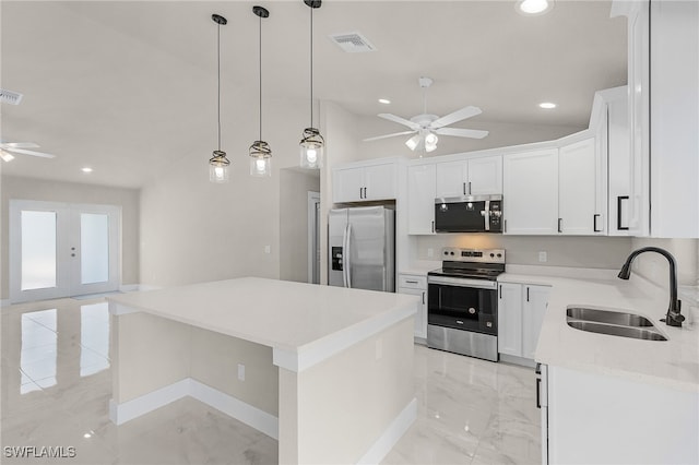 2510 SW 17th Ave, Cape Coral, FL 33914 - kitchen with appliances with stainless steel finishes, ceiling fan, light marble finish flooring, a kitchen island, and recessed lighting