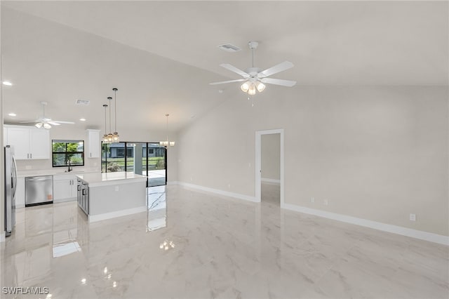 2510 SW 17th Ave, Cape Coral, FL 33914 - unfurnished living room with ceiling fan, recessed lighting, vaulted ceiling, light marble finish flooring, and a chandelier