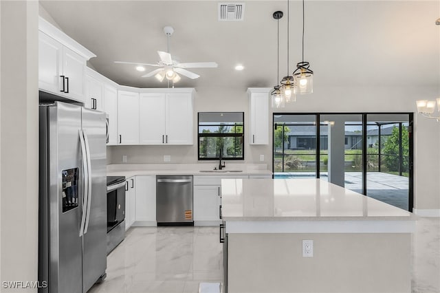 2510 SW 17th Ave, Cape Coral, FL 33914 - kitchen featuring appliances with stainless steel finishes, light marble finish flooring, ceiling fan, plenty of natural light, and recessed lighting