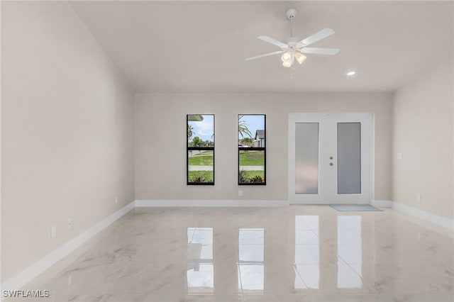 2510 SW 17th Ave, Cape Coral, FL 33914 - spare room featuring light marble finish floors, a ceiling fan, recessed lighting, and french doors