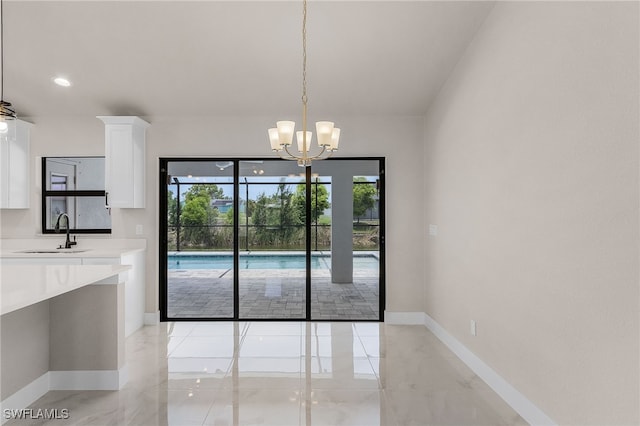 2510 SW 17th Ave, Cape Coral, FL 33914 - unfurnished dining area featuring a chandelier and recessed lighting