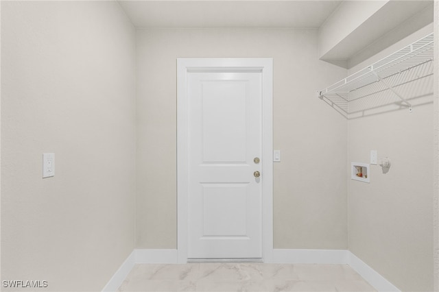 2510 SW 17th Ave, Cape Coral, FL 33914 - laundry area with washer hookup and light marble finish flooring
