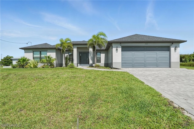 1028 NW 33rd Ave, Cape Coral, FL 33993 - view of front of house with an attached garage, decorative driveway, stucco siding, and a front yard