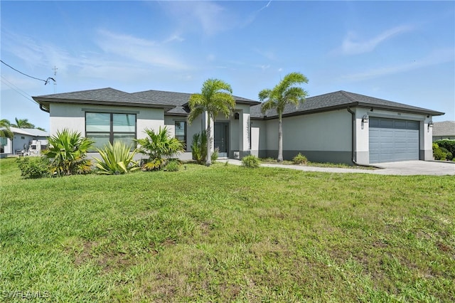 1028 NW 33rd Ave, Cape Coral, FL 33993 - prairie-style house featuring stucco siding, an attached garage, concrete driveway, and a front lawn