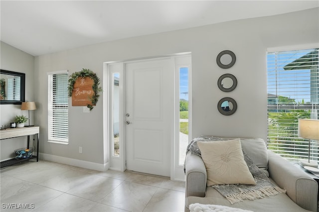 1028 NW 33rd Ave, Cape Coral, FL 33993 - entryway with plenty of natural light and light tile patterned floors