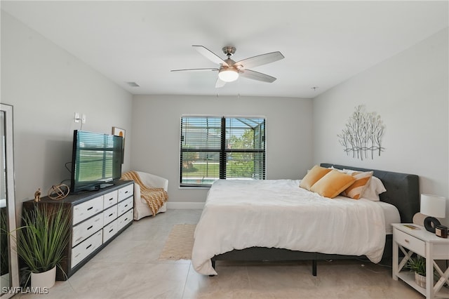 1028 NW 33rd Ave, Cape Coral, FL 33993 - bedroom with ceiling fan and light tile patterned floors