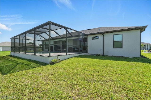 1028 NW 33rd Ave, Cape Coral, FL 33993 - back of property with a lawn, an outdoor pool, stucco siding, a lanai, and a patio area