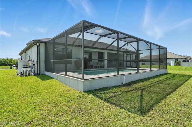 1028 NW 33rd Ave, Cape Coral, FL 33993 - rear view of house with a lawn, an outdoor pool, stucco siding, and a lanai