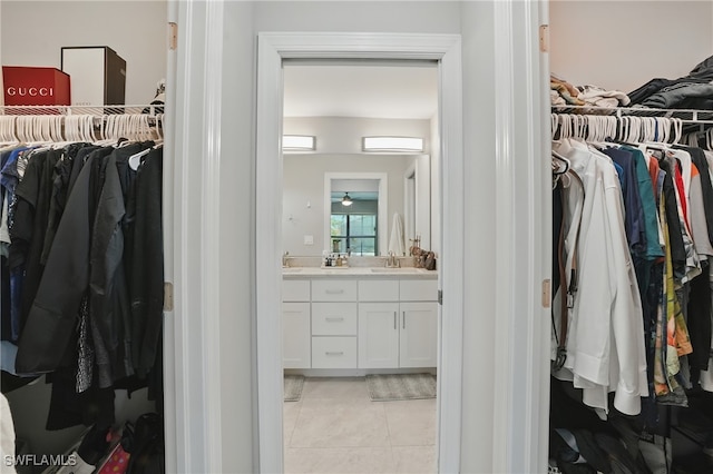 1028 NW 33rd Ave, Cape Coral, FL 33993 - spacious closet featuring light tile patterned floors