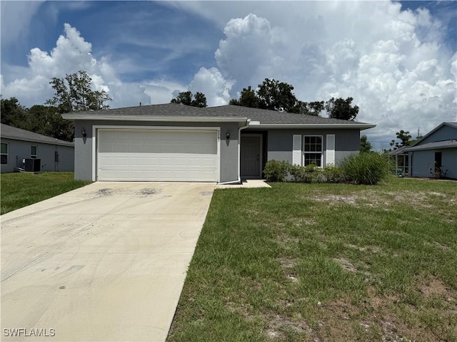 2343 Briarwood St, Punta Gorda, FL 33980 - single story home with stucco siding, an attached garage, concrete driveway, and a front lawn