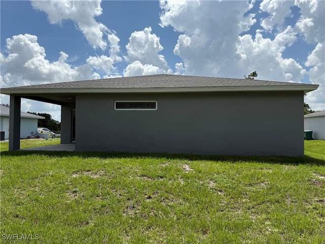 2343 Briarwood St, Punta Gorda, FL 33980 - view of side of property with stucco siding and a lawn