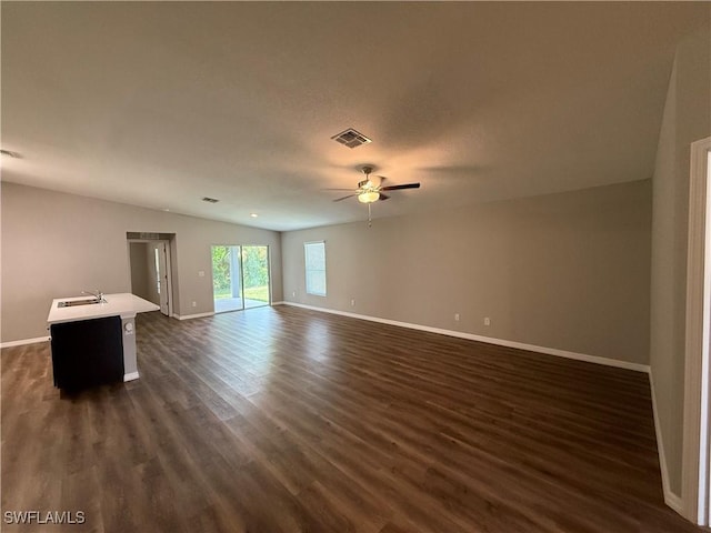 2343 Briarwood St, Punta Gorda, FL 33980 - unfurnished living room featuring a ceiling fan, dark wood-style flooring, and lofted ceiling