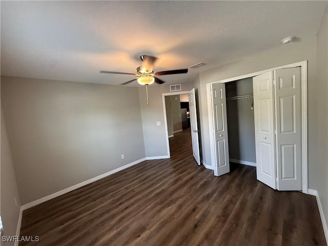 2343 Briarwood St, Punta Gorda, FL 33980 - unfurnished bedroom with dark wood-type flooring, a closet, and a ceiling fan