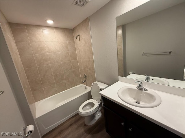 2343 Briarwood St, Punta Gorda, FL 33980 - full bath with bathtub / shower combination, vanity, and wood finished floors