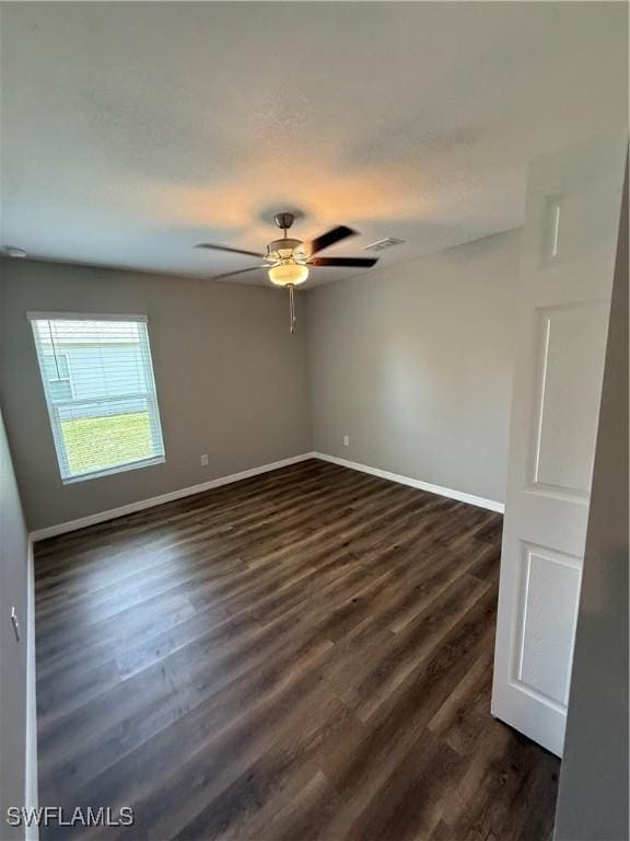 2343 Briarwood St, Punta Gorda, FL 33980 - spare room with dark wood-type flooring and a ceiling fan
