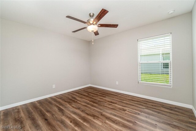 2343 Briarwood St, Punta Gorda, FL 33980 - unfurnished room featuring healthy amount of natural light, dark wood-style floors, a smoke detector, and a ceiling fan