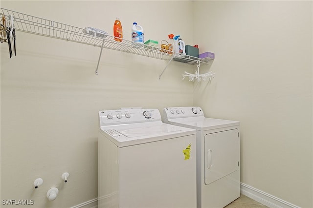 20571 Long Pond Rd, North Fort Myers, FL 33917 - laundry area with independent washer and dryer and light tile patterned flooring