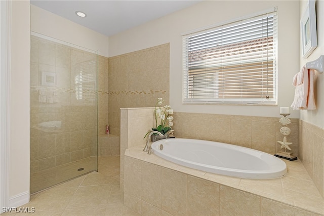 20571 Long Pond Rd, North Fort Myers, FL 33917 - bathroom featuring a bath, walk in shower, tile patterned floors, and recessed lighting