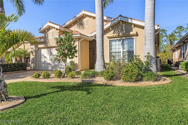 20571 Long Pond Rd, North Fort Myers, FL 33917 - view of front of home with concrete driveway, stucco siding, an attached garage, and a front yard