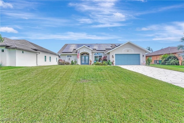2127 SW 49th Ter, Cape Coral, FL 33914 - ranch-style house featuring roof mounted solar panels, driveway, an attached garage, and a front yard