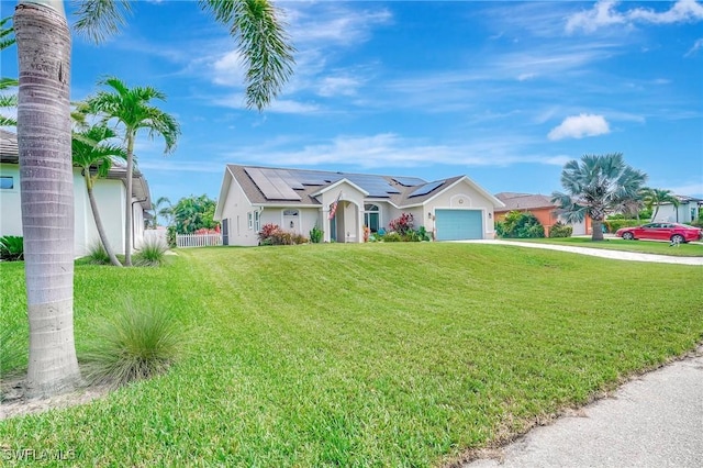 2127 SW 49th Ter, Cape Coral, FL 33914 - ranch-style home featuring solar panels, driveway, an attached garage, and stucco siding