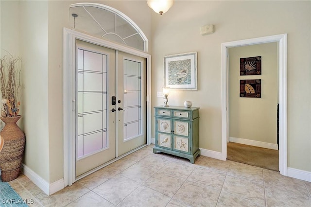 2127 SW 49th Ter, Cape Coral, FL 33914 - entrance foyer featuring french doors and light tile patterned floors