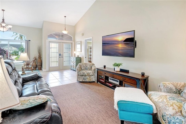 2127 SW 49th Ter, Cape Coral, FL 33914 - living room with french doors, high vaulted ceiling, tile patterned flooring, and carpet