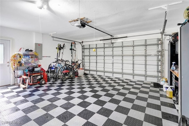 2127 SW 49th Ter, Cape Coral, FL 33914 - garage with electric panel and a garage door opener