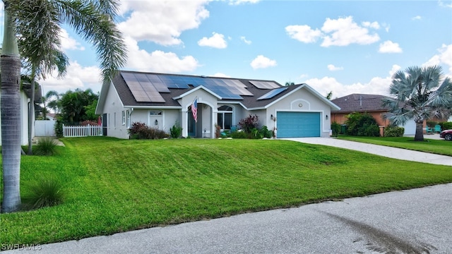 2127 SW 49th Ter, Cape Coral, FL 33914 - single story home featuring solar panels, an attached garage, driveway, and stucco siding