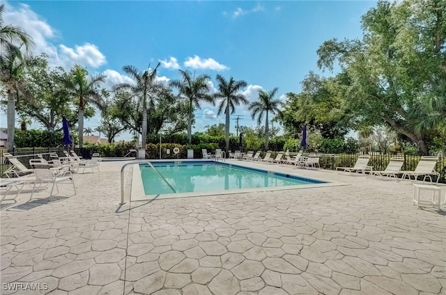 12170 Kelly Greens Blvd Unit 88, Fort Myers, FL 33908 - community pool with a patio area