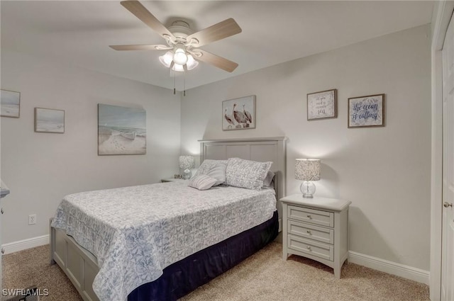 12170 Kelly Greens Blvd Unit 88, Fort Myers, FL 33908 - bedroom with light carpet and a ceiling fan