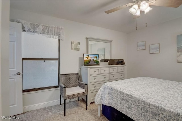 12170 Kelly Greens Blvd Unit 88, Fort Myers, FL 33908 - bedroom featuring light carpet and a ceiling fan