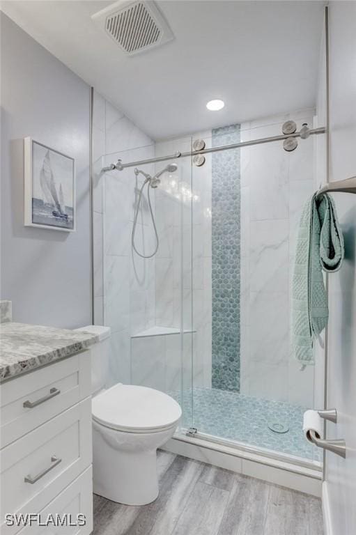 12170 Kelly Greens Blvd Unit 88, Fort Myers, FL 33908 - bathroom with wood finished floors, vanity, a shower stall, and recessed lighting