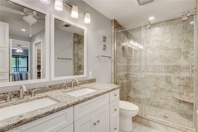 12170 Kelly Greens Blvd Unit 88, Fort Myers, FL 33908 - bathroom with ceiling fan, a shower stall, and double vanity