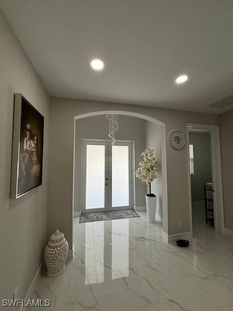 406 W 15th St, Lehigh Acres, FL 33972 - entryway with marble finish floors, recessed lighting, arched walkways, and french doors