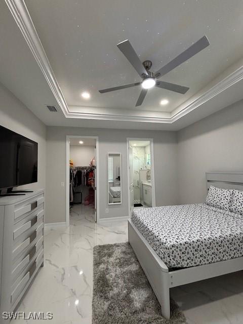 406 W 15th St, Lehigh Acres, FL 33972 - bedroom with a raised ceiling, a spacious closet, recessed lighting, light marble finish floors, and a ceiling fan