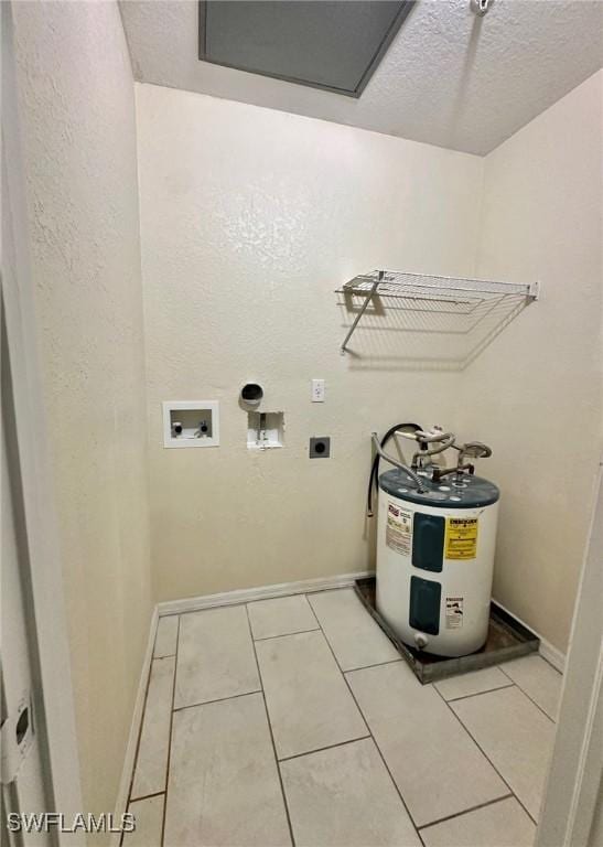 12505 Mcgregor Blvd Unit 204B, Fort Myers, FL 33919 - laundry area with water heater, electric dryer hookup, washer hookup, light tile patterned floors, and a textured ceiling