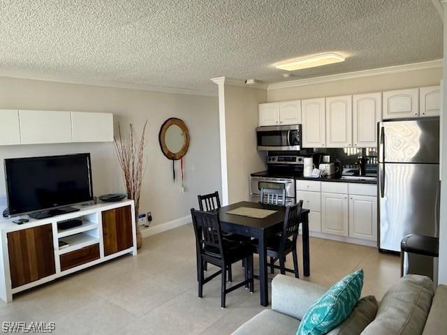 7360 Estero Blvd Unit 901, Fort Myers Beach, FL 33931 - dining space featuring crown molding and a textured ceiling