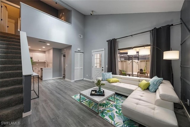 13405 Fox Chapel Ct, Fort Myers, FL 33919 - living room with stairs, wood finished floors, and a towering ceiling