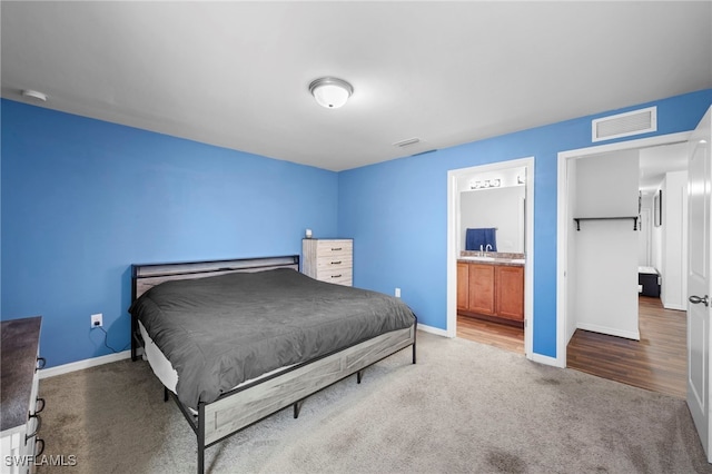 1100 NW 20th St, Cape Coral, FL 33993 - bedroom featuring carpet flooring and ensuite bath