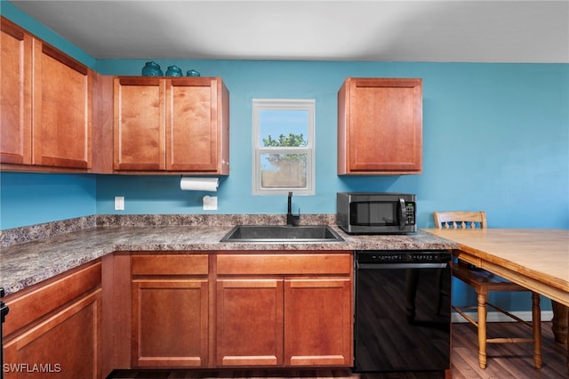 1100 NW 20th St, Cape Coral, FL 33993 - kitchen featuring stainless steel microwave, dishwasher, wood finished floors, and brown cabinets