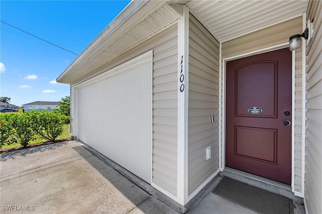 1100 NW 20th St, Cape Coral, FL 33993 - entrance to property with a garage and concrete driveway