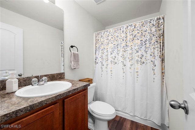 1100 NW 20th St, Cape Coral, FL 33993 - full bathroom featuring vanity, wood finished floors, a shower with shower curtain, and a tub to relax in