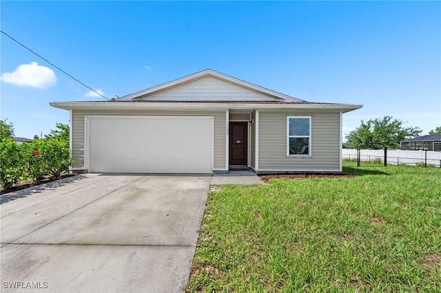 1100 NW 20th St, Cape Coral, FL 33993 - ranch-style house with concrete driveway and a garage